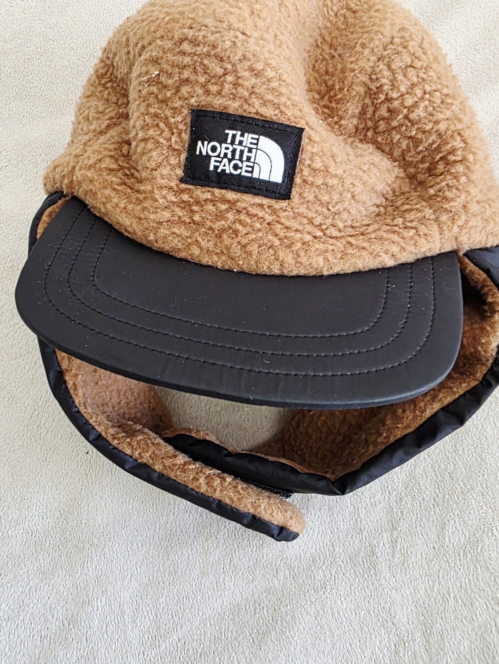 The North Face Toddler Camel Sherpa Trapper Hat with Black Brim